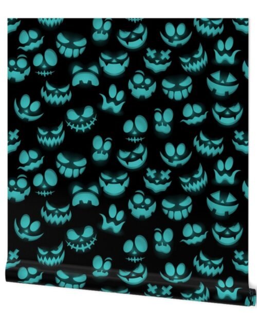 Grinning Halloween Jack o Lantern Faces in Aqua on Black Wallpaper