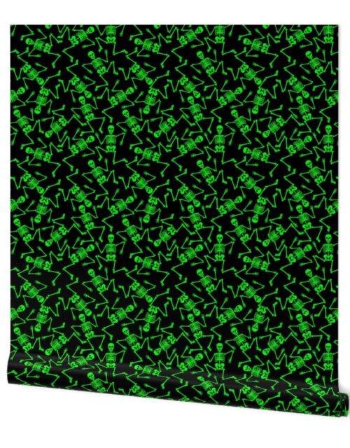 Small Bright Green Dancing Halloween Skeletons Scattered On Black Wallpaper