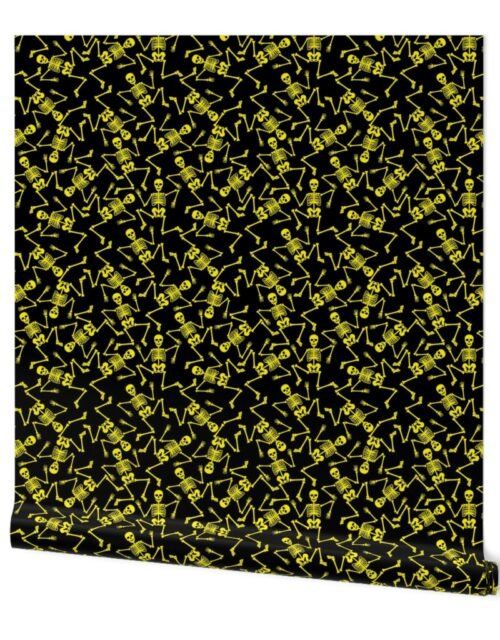 Small Bright Yellow Dancing Halloween Skeletons Scattered On Black Wallpaper