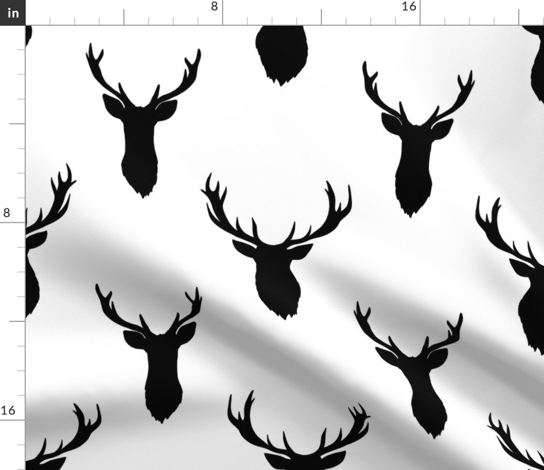 Large Black Buck Deer Trophy Heads with Antler Racks Mounted on White Fabric