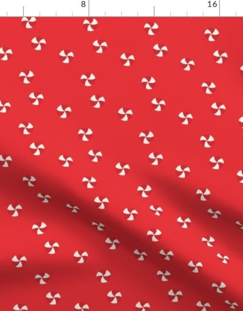 Peppermint Swirls in Red and White Scattered Randomly on on Red Fabric