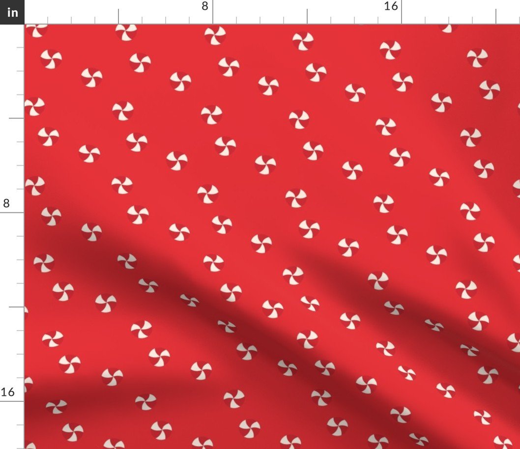 Peppermint Swirls in Red and White Scattered Randomly on on Red Fabric