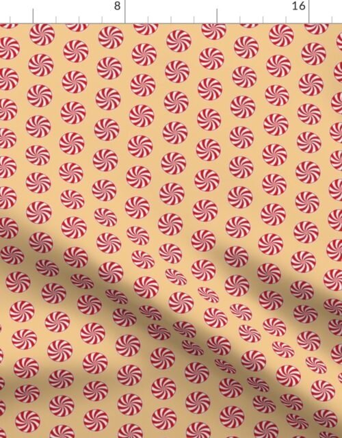Red and White Peppermint Christmas Candy Swirls on Antique Gold Fabric