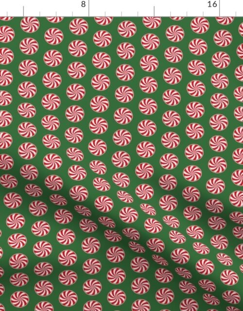 Red and White Peppermint Christmas Candy Swirls on Tree Green Fabric