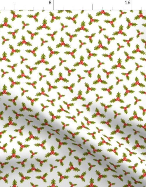 Sprigs of Christmas Green Holly with Red Berries on White Fabric