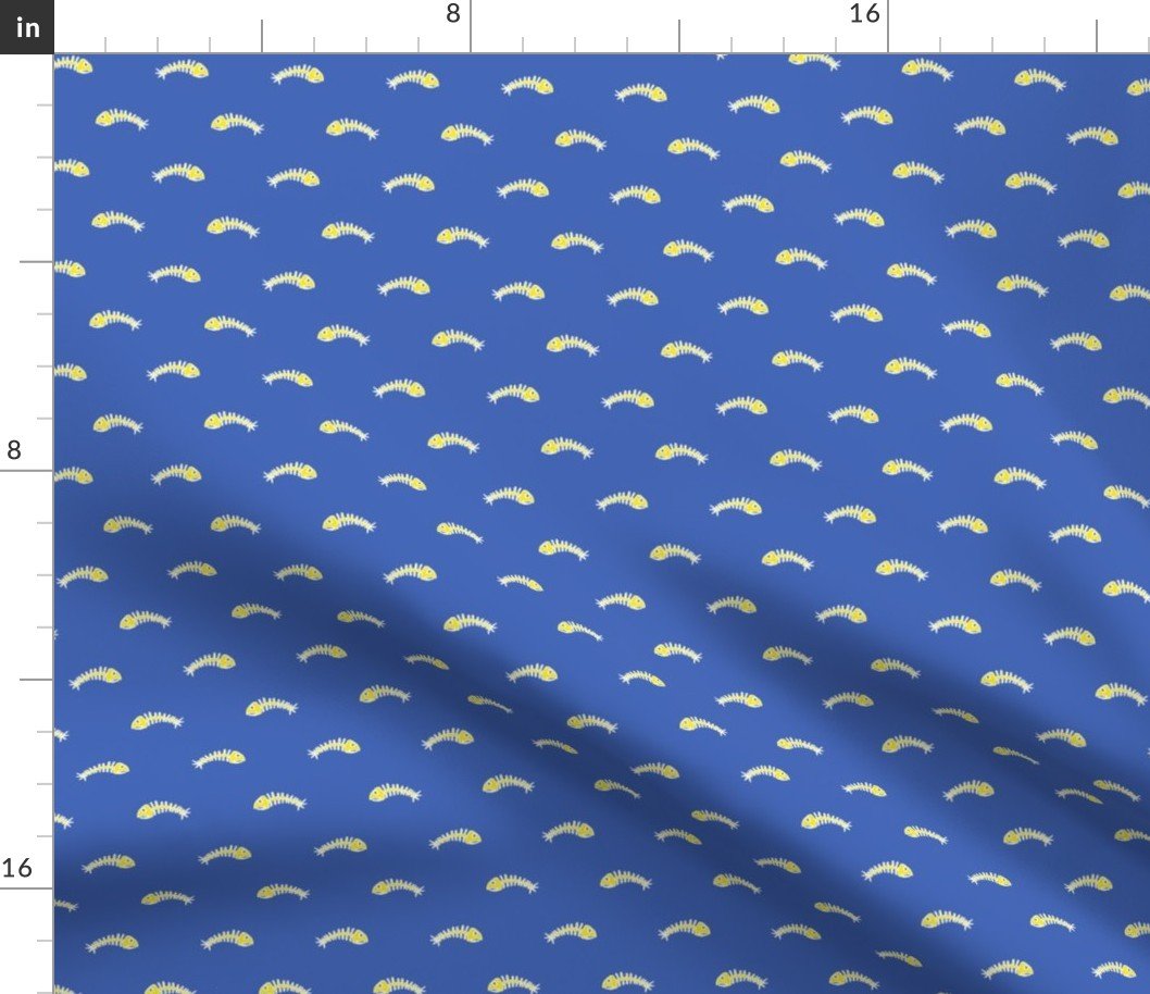White and Yellow Fishbones Skeletons on Midi Blue Fabric White and Yellow Fishbones Skeletons on Midi Blue Fabric