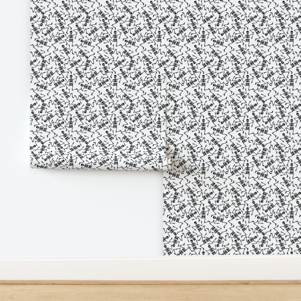 Small Black Dancing Halloween Skeletons Scattered On White Wallpaper design
