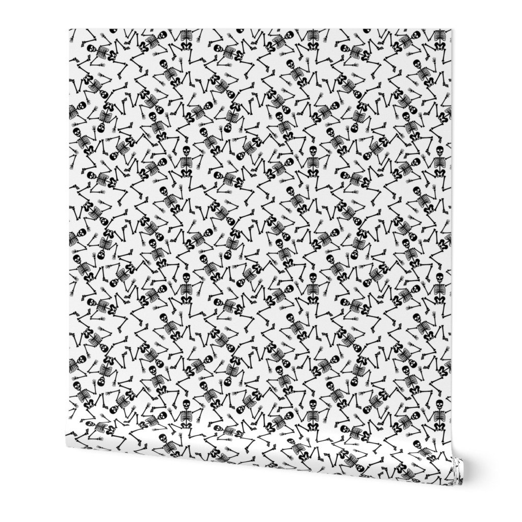 Small Black Dancing Halloween Skeletons Scattered On White Wallpaper scattered skeletons wallpaper
