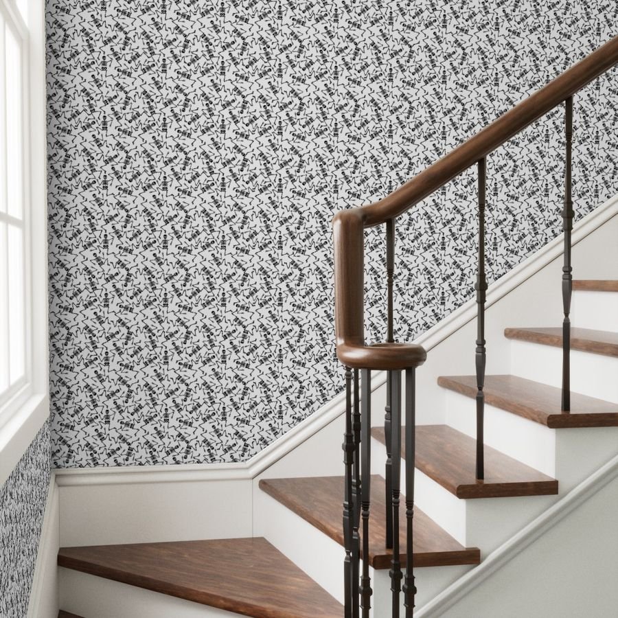 Small Black Dancing Halloween Skeletons Scattered On White Wallpaper black and white wallpaper