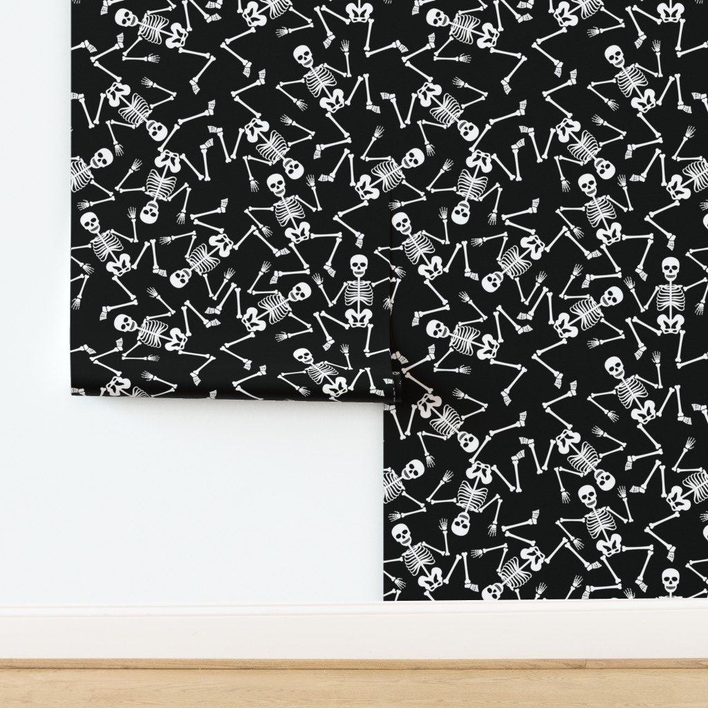Large White Dancing Halloween Skeletons Scattered On Black Wallpaper design