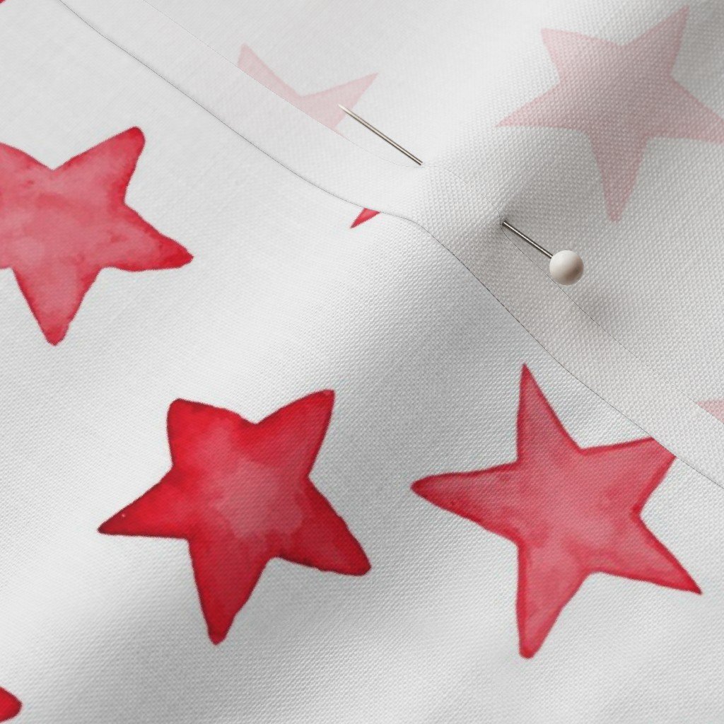 Faded Red Christmas Stars on White Fabric faded red fabric