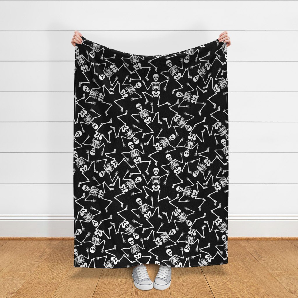 Large White Dancing Halloween Skeletons Scattered On Black Fabric black and white fabric