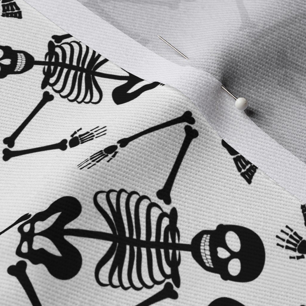 Small Black Dancing Halloween Skeletons Scattered On White Fabric black bones fabric