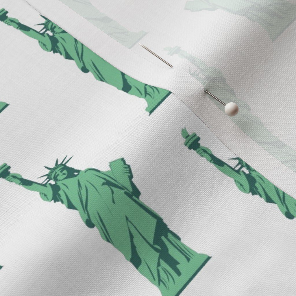 Mini Lady Liberty Statues Repeat in Beguiling Green on White Fabric beguiling green fabric