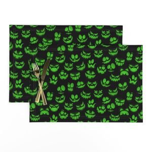 Mini Grinning Halloween Jack o Lantern Faces in Neon Green on Black Design Collection Interior Collection luminous faces placemat design