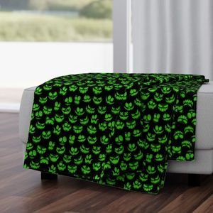 Mini Grinning Halloween Jack o Lantern Faces in Neon Green on Black Design Collection Interior Collection jack o lantern faces throw blanket design
