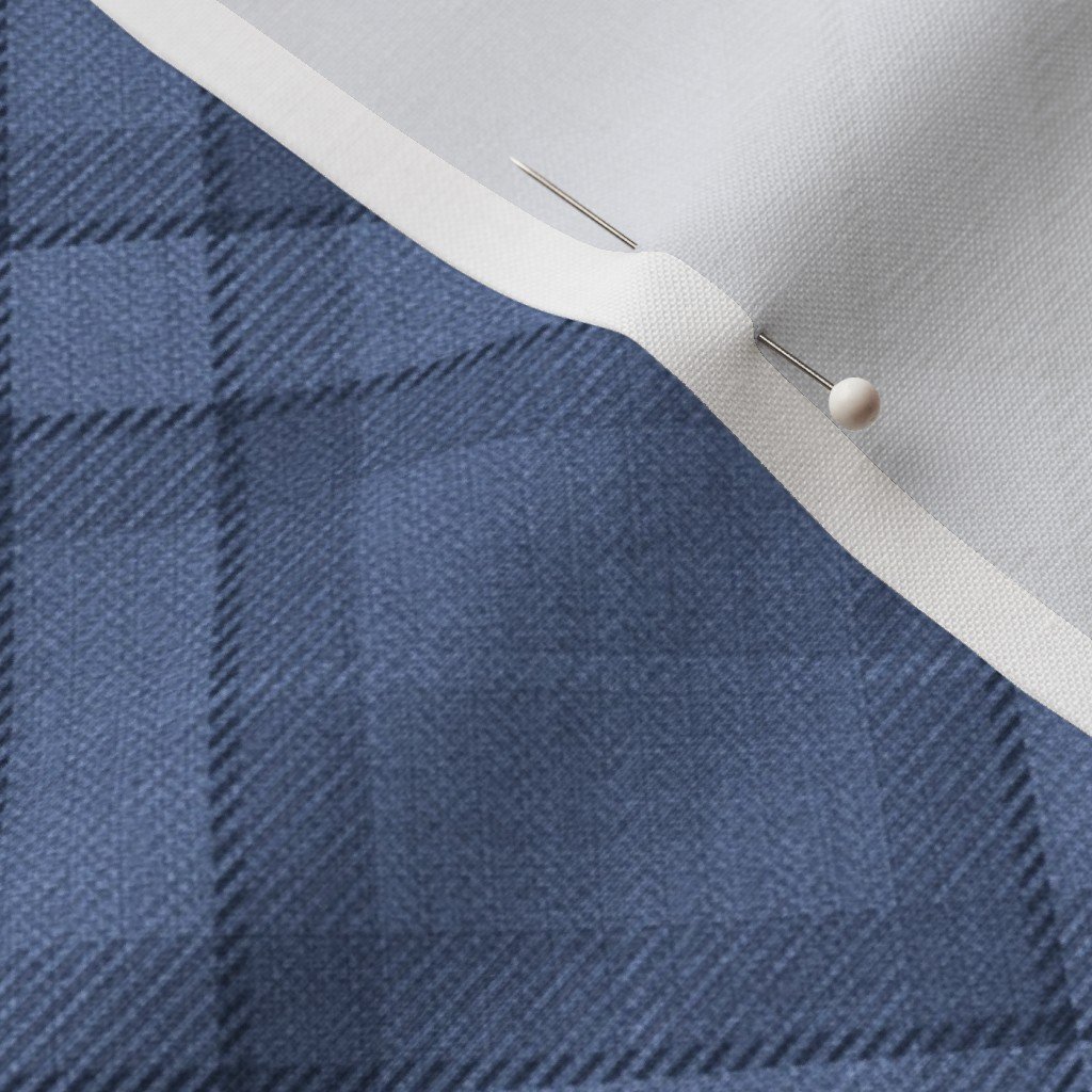 Close-up fabric detail with sewing pin
