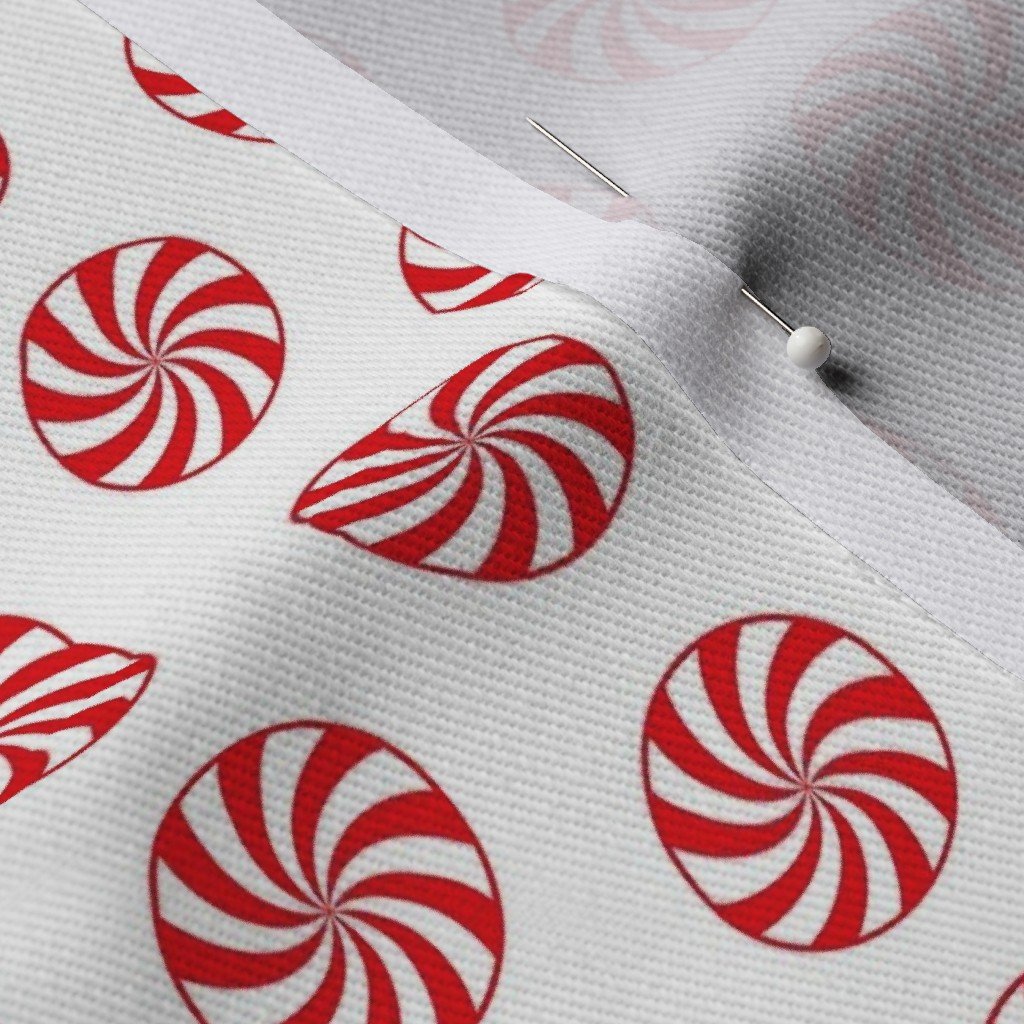 Red and White Peppermint Christmas Candy Swirls on White Fabric peppermint on white fabric