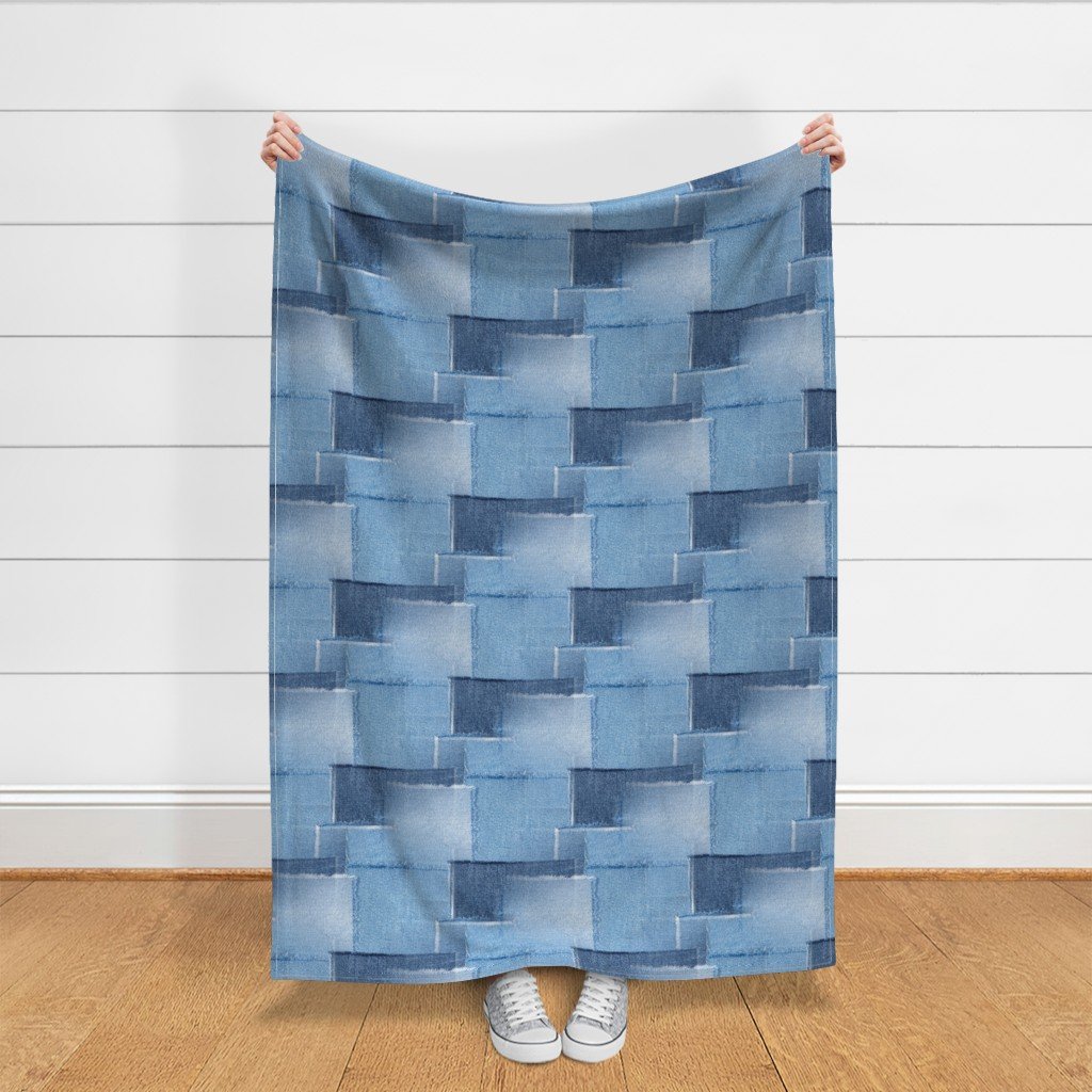 Abstract Patchwork Pattern of Frayed and Fringed Patches of Blue Fabric blue on blue fabric