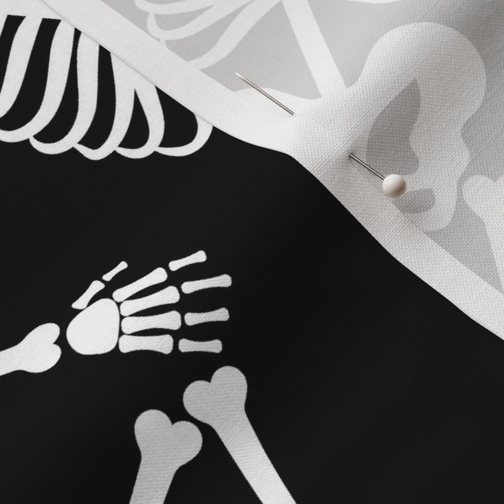 Large White Dancing Halloween Skeletons Scattered On Black Fabric scattered skeletons fabric