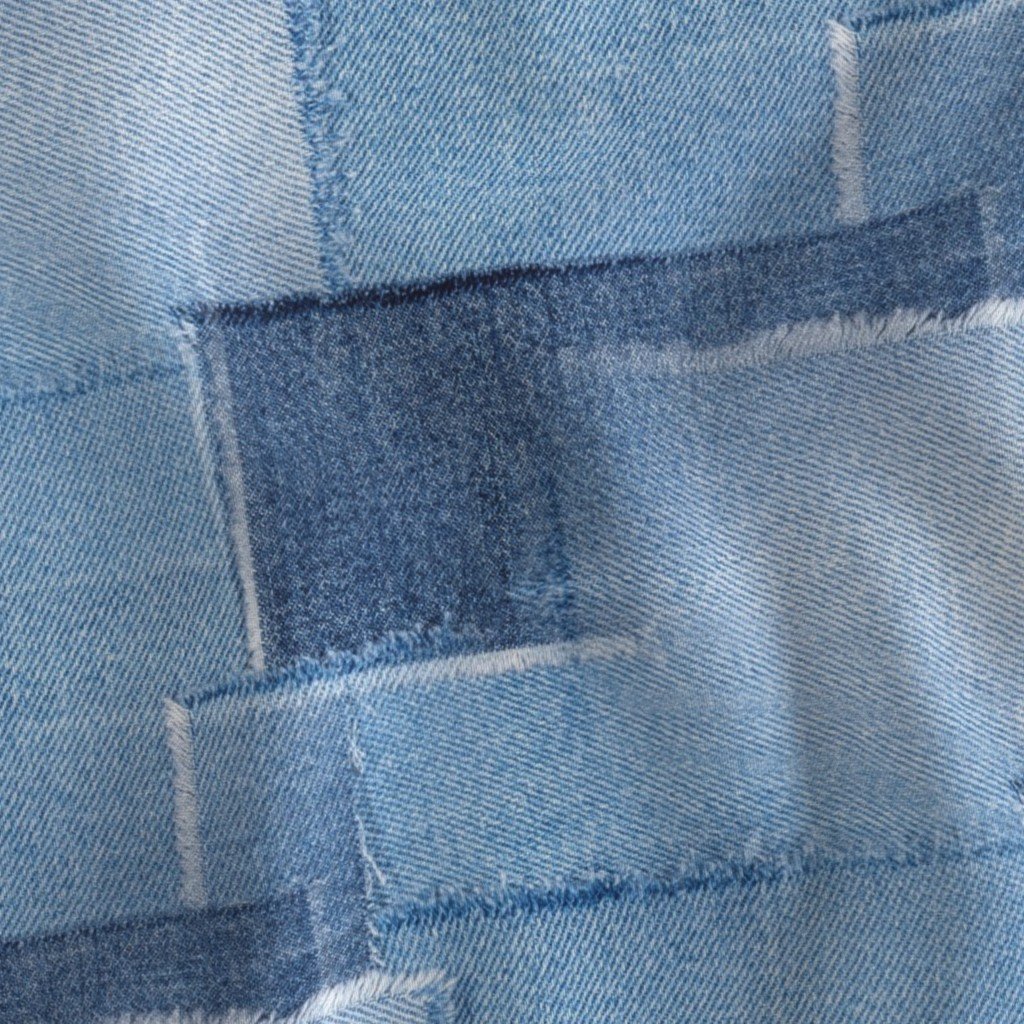 Abstract Patchwork Pattern of Frayed and Fringed Patches of Blue Fabric denim blue fabric