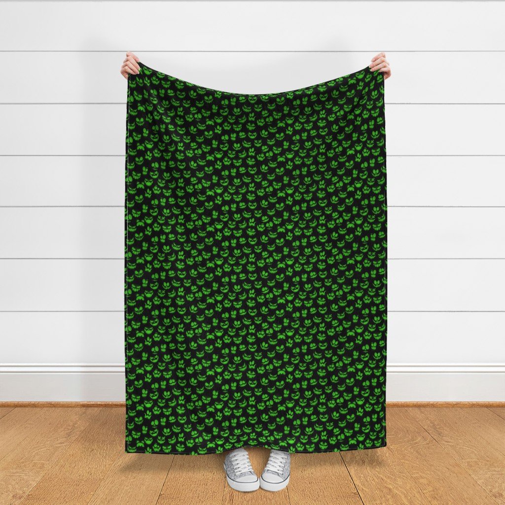Mini Grinning Halloween Jack o Lantern Faces in Neon Green on Black Fabric luminous faces fabric