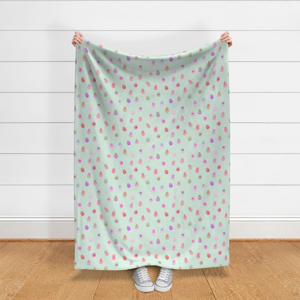Throw blanket held up in front of shiplap wall